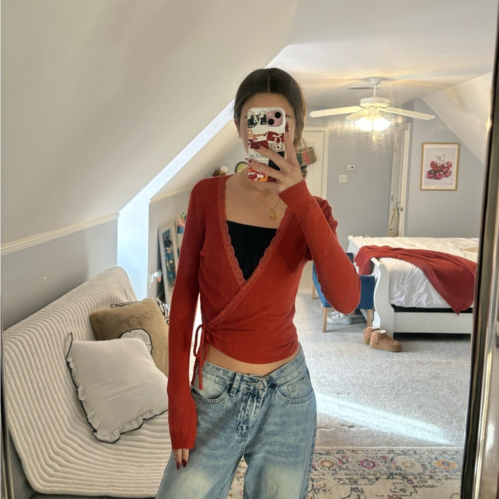 Urban Outfitters red wrap top with lace trim details
EUC